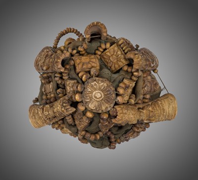 Lot 287 - A NECROMANCER’S BONE HEADDRESS, WRISTBAND AND APRON, TIBET OR NEPAL, 18TH-19TH CENTURY