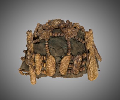 Lot 287 - A NECROMANCER’S BONE HEADDRESS, WRISTBAND AND APRON, TIBET OR NEPAL, 18TH-19TH CENTURY