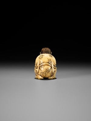 Lot 71 - MASATSUGU: AN AMUSING OSAKA SCHOOL IVORY NETSUKE OF GAMA SENNIN LIFTING HIS TOAD