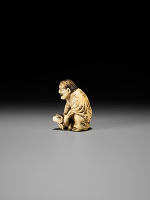 Lot 71 - MASATSUGU: AN AMUSING OSAKA SCHOOL IVORY NETSUKE OF GAMA SENNIN LIFTING HIS TOAD