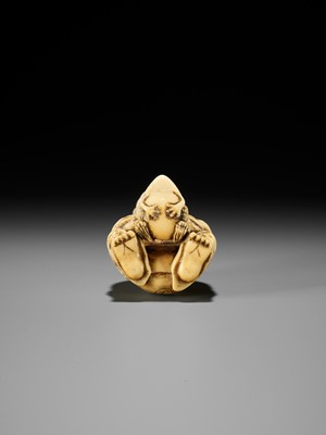 Lot 71 - MASATSUGU: AN AMUSING OSAKA SCHOOL IVORY NETSUKE OF GAMA SENNIN LIFTING HIS TOAD