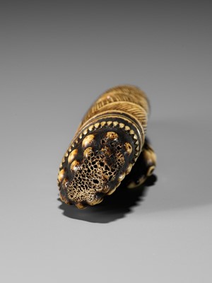 AN EARLY ANTLER NETSUKE DEPICTING A RAT ON A BAMBOO SHOOT