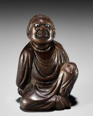 Lot 158 - A FINE NETSUKE OF A SEATED IMMORTAL, ATTRIBUTED TO MIWA