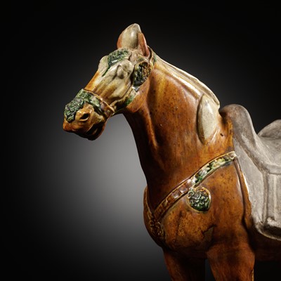 Lot 131 - A LARGE AND FINE SANCAI GLAZED APPLIQUÉ-DECORATED POTTERY FIGURE OF A HORSE, TANG DYNASTY