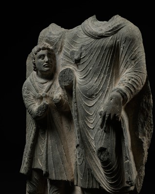 A LARGE GRAY SCHIST RELIEF DEPICTING BUDDHA AND A ROYAL DONOR, ANCIENT REGION OF GANDHARA