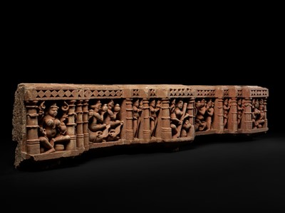 A RED STANDSTONE RELIEF DEPICTING SARASWATI WITH ATTENDANTS, CENTRAL INDIA, 10TH-12TH CENTURY