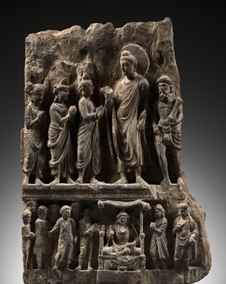 Lot 229 - A SCHIST RELIEF PANEL DEPICTING THE GIFT OF THE GOLDEN CLOTH, ANCIENT REGION OF GANDHARA