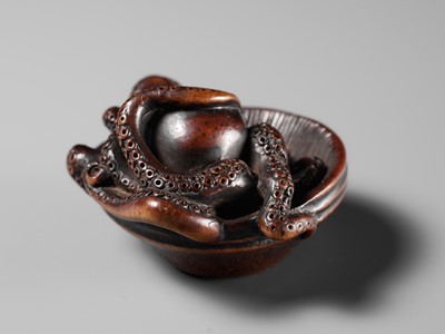 Lot 114 - MASATOMO: A SUPERB NAGOYA SCHOOL WOOD NETSUKE OF AN OCTOPUS IN SURIBACHI