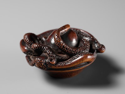 Lot 114 - MASATOMO: A SUPERB NAGOYA SCHOOL WOOD NETSUKE OF AN OCTOPUS IN SURIBACHI