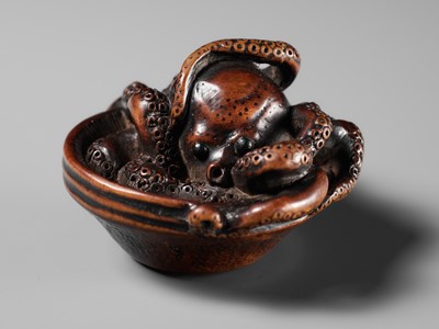 Lot 114 - MASATOMO: A SUPERB NAGOYA SCHOOL WOOD NETSUKE OF AN OCTOPUS IN SURIBACHI