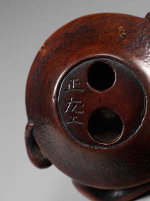 Lot 114 - MASATOMO: A SUPERB NAGOYA SCHOOL WOOD NETSUKE OF AN OCTOPUS IN SURIBACHI