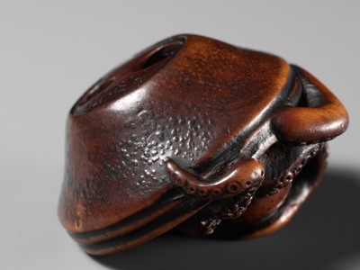 Lot 114 - MASATOMO: A SUPERB NAGOYA SCHOOL WOOD NETSUKE OF AN OCTOPUS IN SURIBACHI