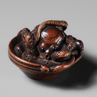 Lot 114 - MASATOMO: A SUPERB NAGOYA SCHOOL WOOD NETSUKE OF AN OCTOPUS IN SURIBACHI