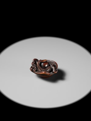 Lot 114 - MASATOMO: A SUPERB NAGOYA SCHOOL WOOD NETSUKE OF AN OCTOPUS IN SURIBACHI