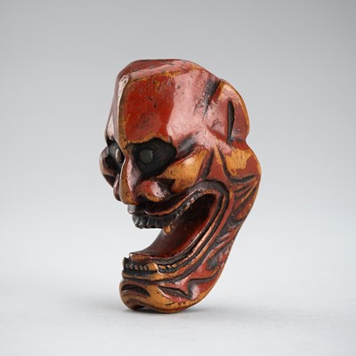 A LACQUERED WOOD MASK NETSUKE OF A DEMON, EDO PERIOD