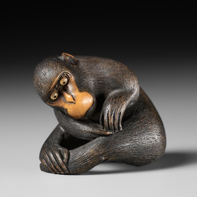 Lot 446 - KOICHI: A WOOD NETSUKE OF A MONKEY PICKING FLEAS