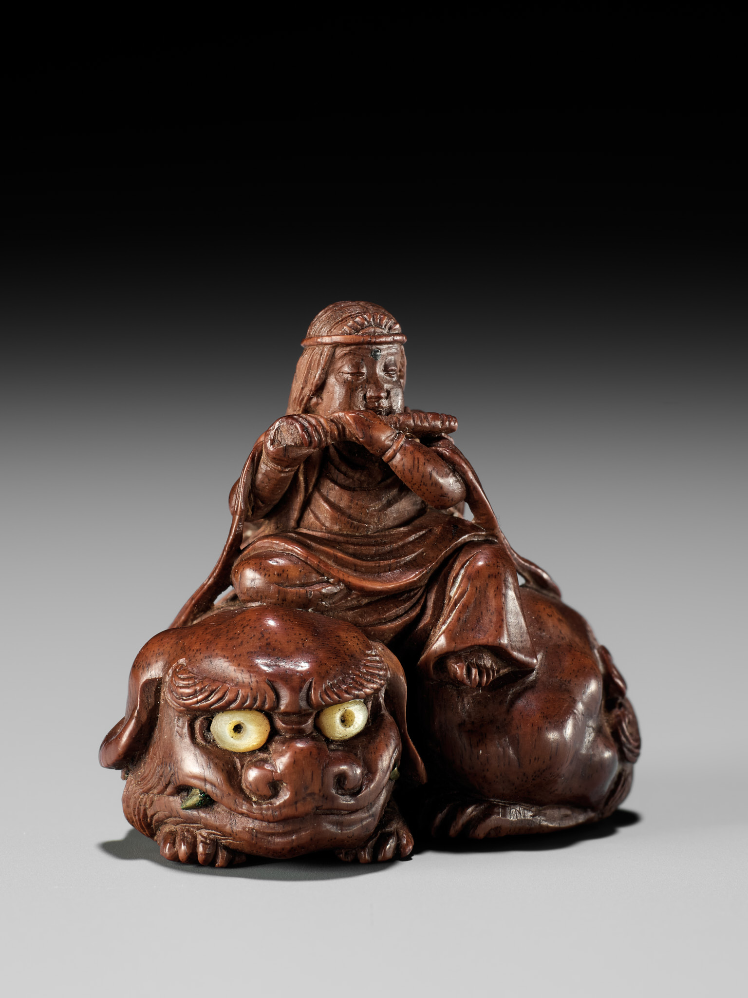Lot 208 - KEIKOKU: A VERY FINE INLAID WOOD NETSUKE OF