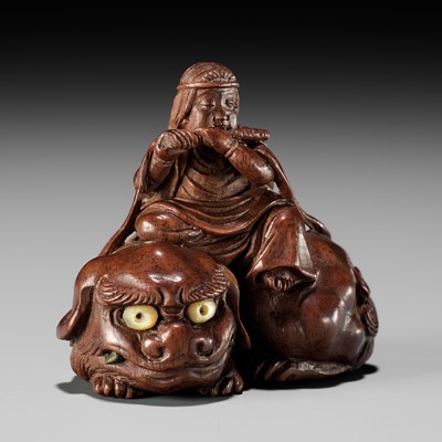 Lot 208 - KEIKOKU: A VERY FINE INLAID WOOD NETSUKE OF MONJU BOSATSU