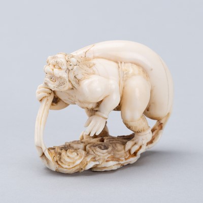 Lot 721 - A MARINE IVORY NETSUKE-OKIMONO OF FUJIN