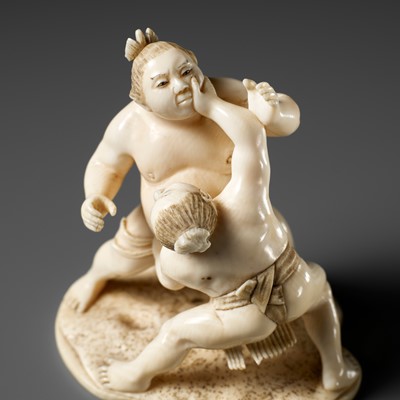 Lot 378 - EISHIN: AN IVORY OKIMONO OF TWO SUMO WRESTLERS