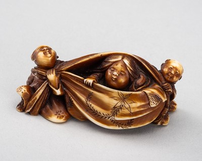 Lot 599 - GYOKUMIN: AN IVORY NETSUKE OF OKAME AND TWO KARAKO