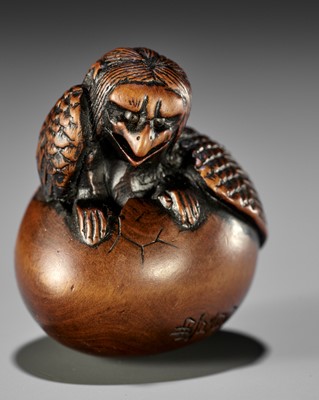 Lot 121 - NAITO TOYOMASA: A FINE WOOD NETSUKE OF A HATCHING TENGU (TENGU NO TOMAGO)