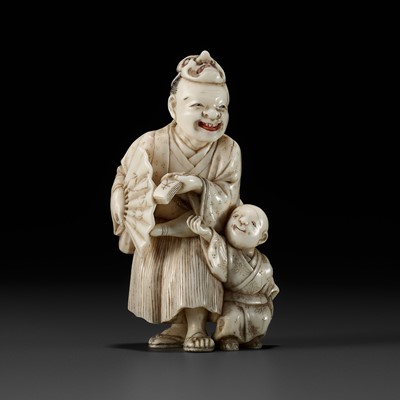 Lot 503 - KOJU: A FINE IVORY NETSUKE OF AN ACTOR AND BOY