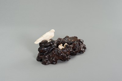Lot 262 - A BONE OKIMONO GROUP OF A COUPLE OF BIRDS WITH CHICKS