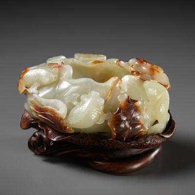 Lot 113 - A PALE CELADON AND RUSSET JADE ‘LOTUS POND’ BRUSH WASHER, 18TH CENTURY
