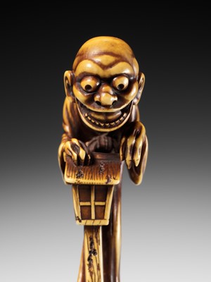 Lot 68 - HIDEMASA: A SUPERB AND LARGE IVORY NETSUKE OF THE BAKEMONO MIKOSHI NYUDO