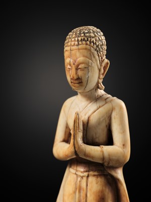 Lot 278 - A RARE IVORY FIGURE OF SARIPUTRA, THAILAND, 1750-1850