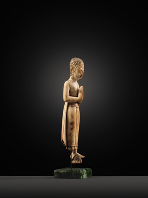 Lot 278 - A RARE IVORY FIGURE OF SARIPUTRA, THAILAND, 1750-1850