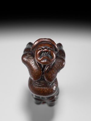 Lot 24 - A LARGE WOOD NETSUKE OF A DUTCHMAN WITH A DRUM