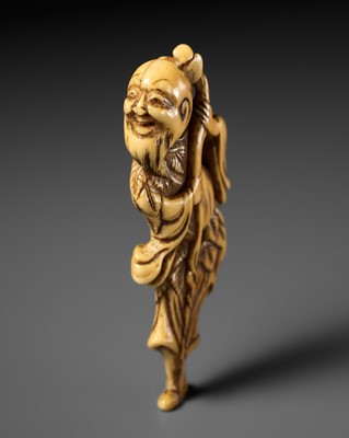 AN EARLY IVORY NETSUKE OF TOBOSAKU SENNIN