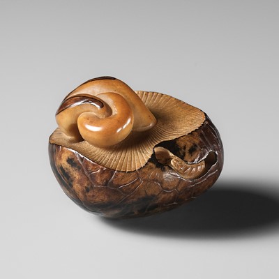 Lot 284 - YOSHIMASA: A RARE COROZO NUT NETSUKE OF TWO MUSHROOMS AND A WORM