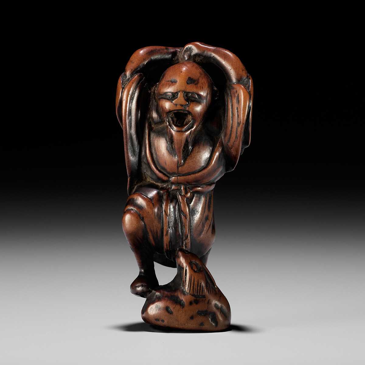 Lot 21 - A RARE AND EARLY WOOD NETSUKE OF KOSHOHEI