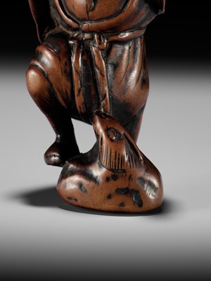 Lot 21 - A RARE AND EARLY WOOD NETSUKE OF KOSHOHEI