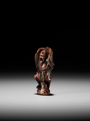 Lot 21 - A RARE AND EARLY WOOD NETSUKE OF KOSHOHEI