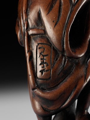 Lot 21 - A RARE AND EARLY WOOD NETSUKE OF KOSHOHEI