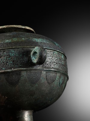 Lot 64 - AN ARCHAIC BRONZE RITUAL FOOD VESSEL AND COVER, DOU, WITH ELEVEN BANDS OF DECORATION, LATE SPRING AND AUTUMN TO EARLY WARRING STATES PERIOD