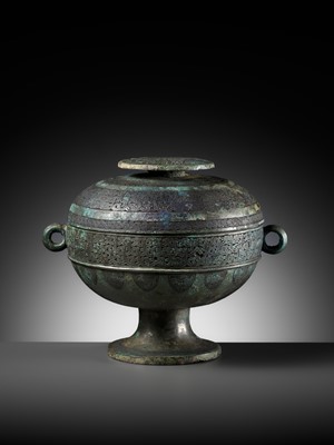 Lot 64 - AN ARCHAIC BRONZE RITUAL FOOD VESSEL AND COVER, DOU, WITH ELEVEN BANDS OF DECORATION, LATE SPRING AND AUTUMN TO EARLY WARRING STATES PERIOD