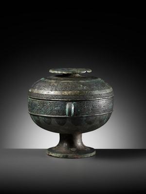 Lot 64 - AN ARCHAIC BRONZE RITUAL FOOD VESSEL AND COVER, DOU, WITH ELEVEN BANDS OF DECORATION, LATE SPRING AND AUTUMN TO EARLY WARRING STATES PERIOD