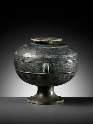 Lot 64 - AN ARCHAIC BRONZE RITUAL FOOD VESSEL AND COVER, DOU, WITH ELEVEN BANDS OF DECORATION, LATE SPRING AND AUTUMN TO EARLY WARRING STATES PERIOD