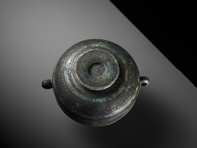 Lot 64 - AN ARCHAIC BRONZE RITUAL FOOD VESSEL AND COVER, DOU, WITH ELEVEN BANDS OF DECORATION, LATE SPRING AND AUTUMN TO EARLY WARRING STATES PERIOD