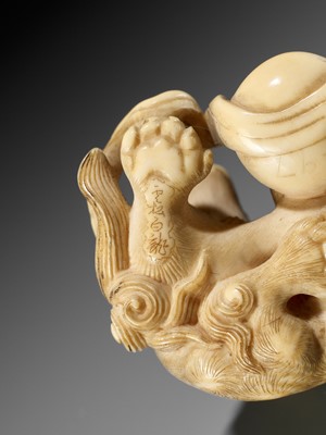 Lot 47 - HAKURYU: A FINE IVORY NETSUKE OF A SHISHI AND YOUNG