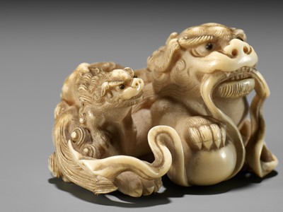 Lot 47 - HAKURYU: A FINE IVORY NETSUKE OF A SHISHI AND YOUNG