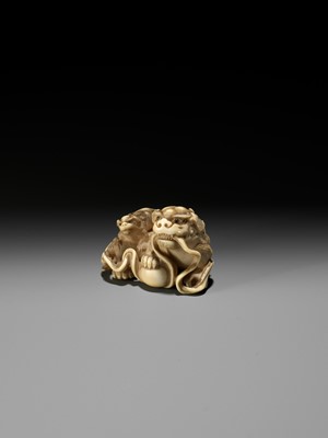 Lot 47 - HAKURYU: A FINE IVORY NETSUKE OF A SHISHI AND YOUNG