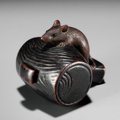 Lot 81 - A WOOD NETSUKE OF A RAT ON DAIKOKU’S MALLET