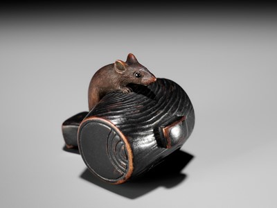 Lot 81 - A WOOD NETSUKE OF A RAT ON DAIKOKU’S MALLET