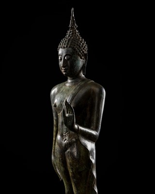 Lot 589 - A BRONZE FIGURE OF A WALKING BUDDHA, SUKHOTHAI STYLE